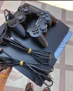 Playstation 3 Fat. Comes With 18 Games and 2 Controllers