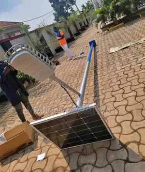 Photo - Installing Solar Flood Lights.