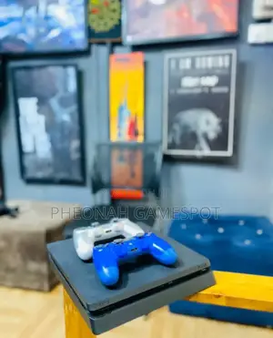 Play Station 4 Slim 
Comes With 2 Controllers
15 Games.