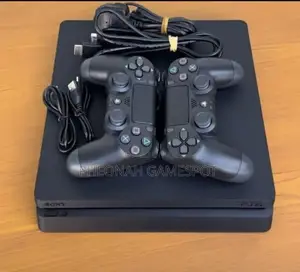 Play Station 4 Slim 
Comes With 2 Controllers
15 Games.