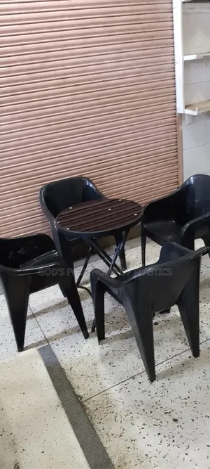 Photo - Plastic Sofa Chairs and Round Glass Table Foldable