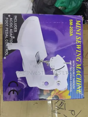 Photo - Electric Mini Sewing Machine