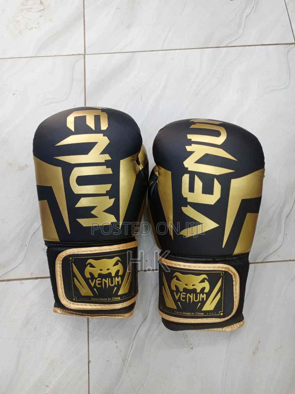 Venum Elite Boxing Glove in Black and Gold.