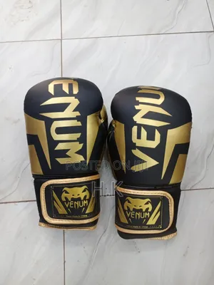 Venum Elite Boxing Glove in Black and Gold.