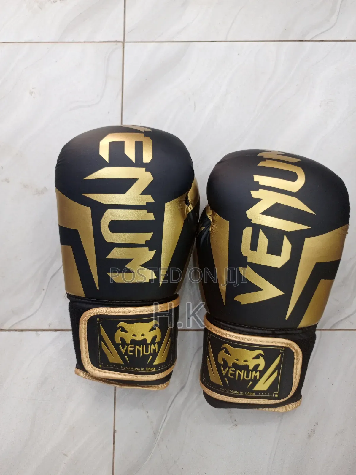 Venum Elite Boxing Glove in Black and Gold.