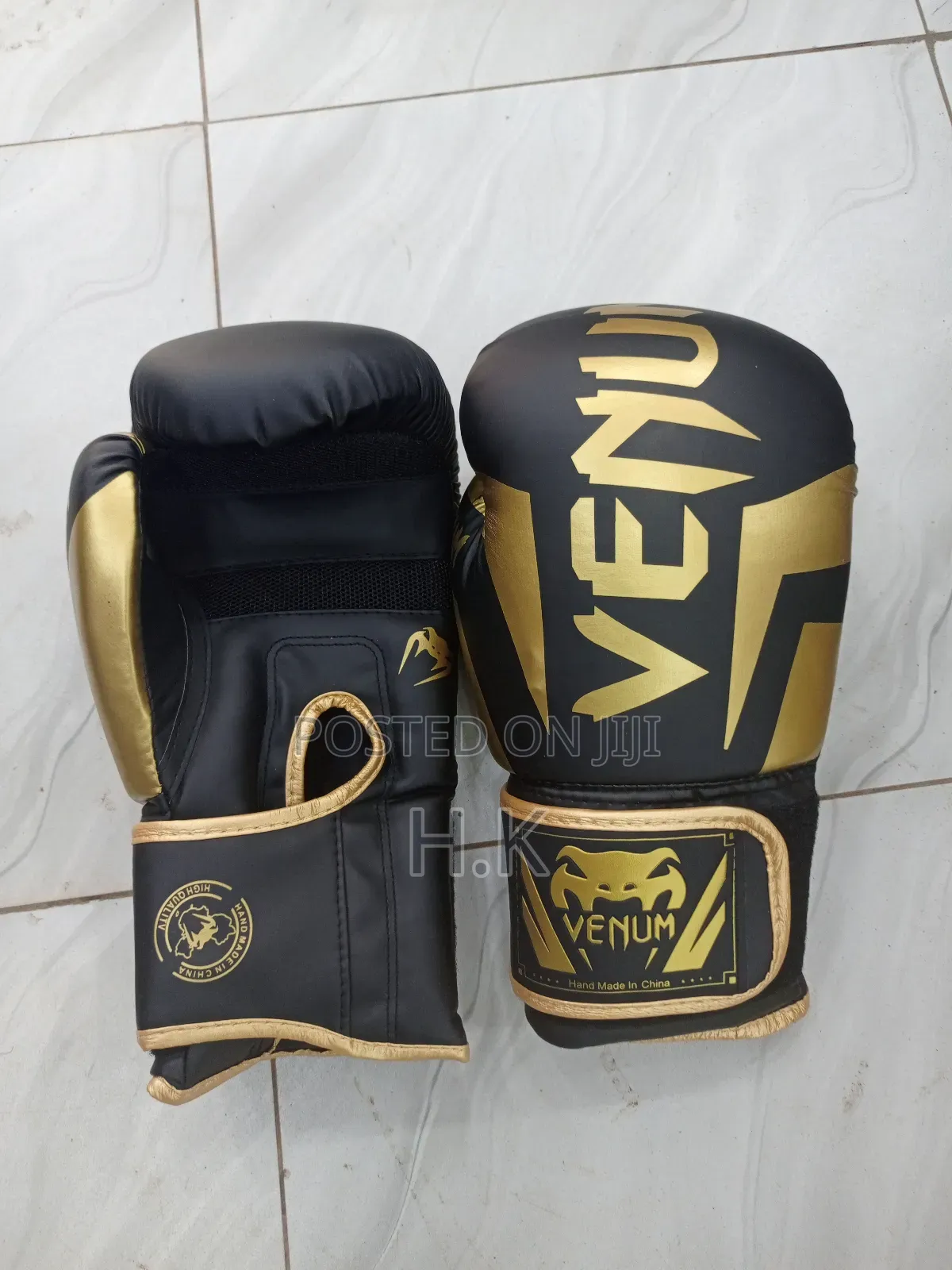 Venum Elite Boxing Glove in Black and Gold.