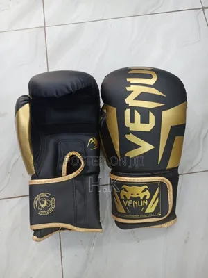 Venum Elite Boxing Glove in Black and Gold.