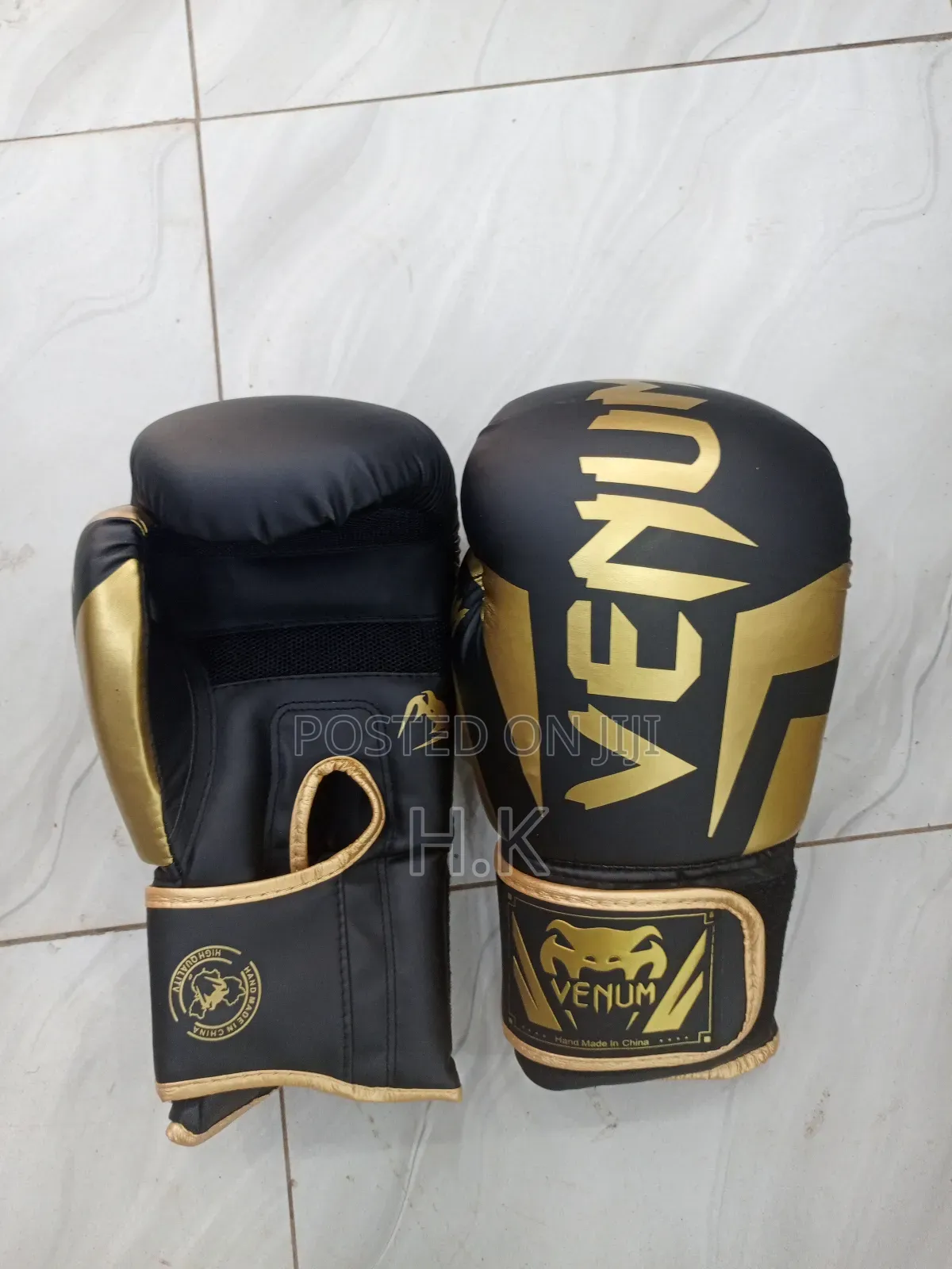 Venum Elite Boxing Glove in Black and Gold.