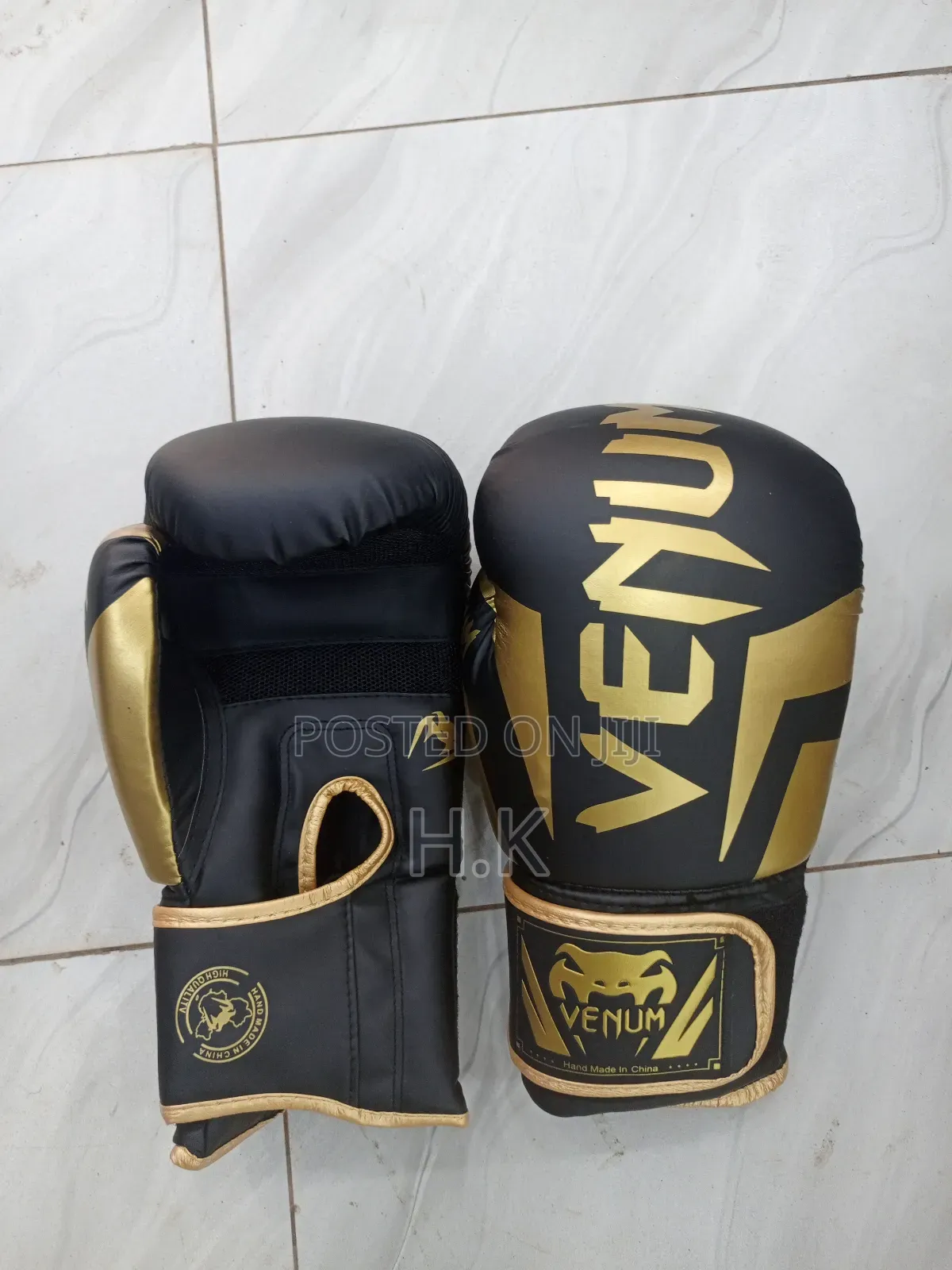 Venum Elite Boxing Glove in Black and Gold.