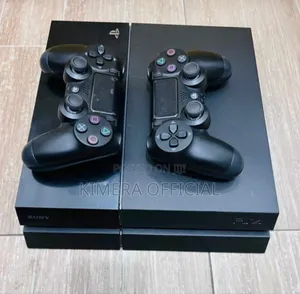Photo - Ps4 Standard for Sale. Comes With 10 Games and 2 Controllers