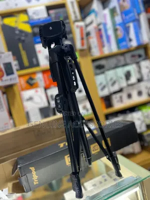 Phone and Camera Tripod Stand With a Remote