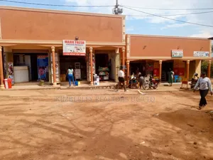Photo - Rubaga Road, Kasubi Kawala:6 Shops and 3 Single Rooms at 320m