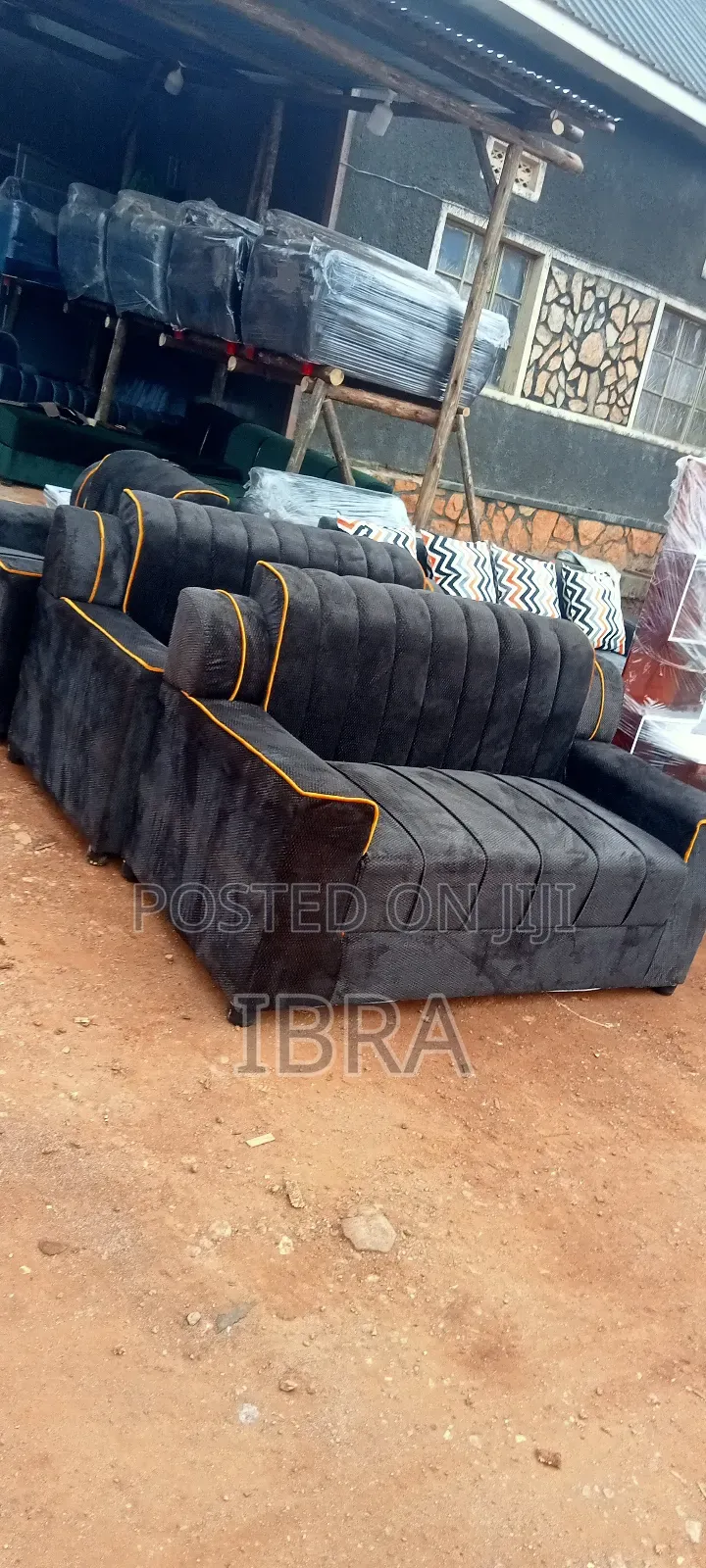 A Five Seater Sofa Set With a Yellow Strip