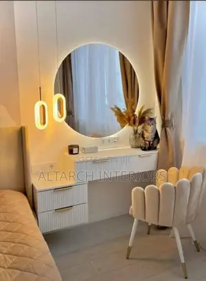 Modern Dressing With Round Mirror and a Dressed Chair