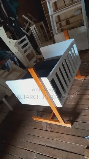 Simple Moving Babycoat With Casters Down for It to Move Smoothly