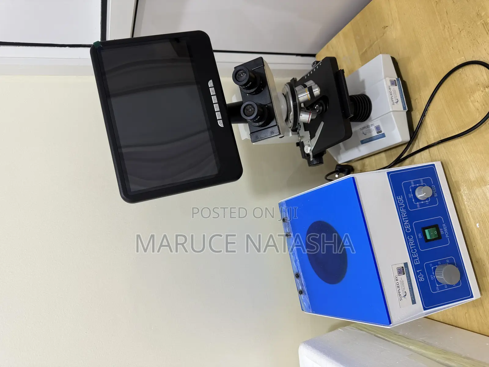 A Set of a Trinocular Microscope With a 6 Buckets Electric Centrifuge