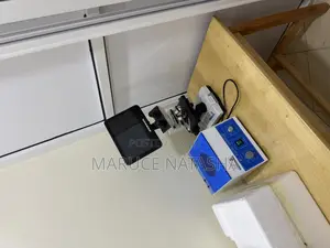 A Set of a Trinocular Microscope With a 6 Buckets Electric Centrifuge