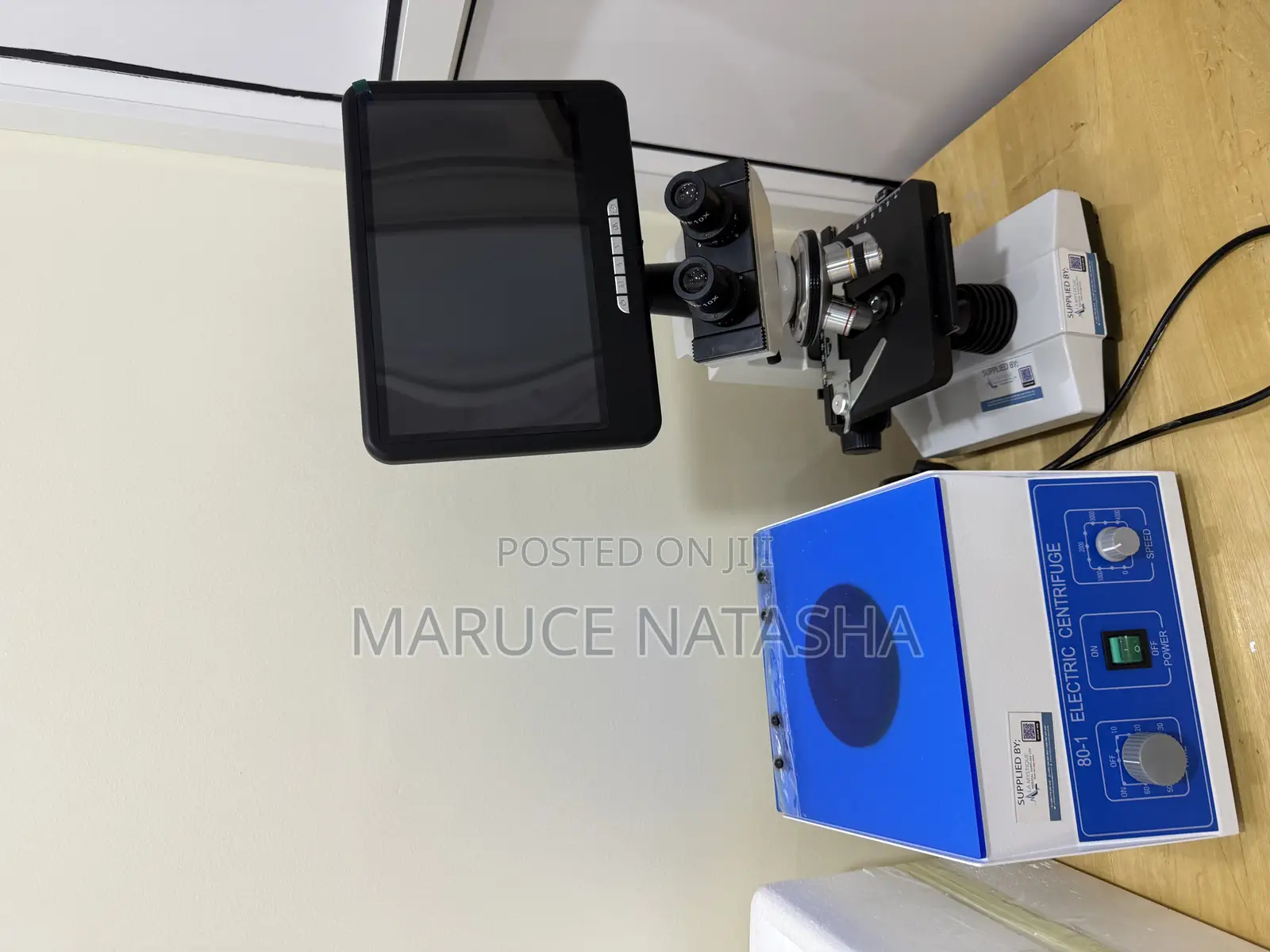 A Set of a Trinocular Microscope With a 6 Buckets Electric Centrifuge