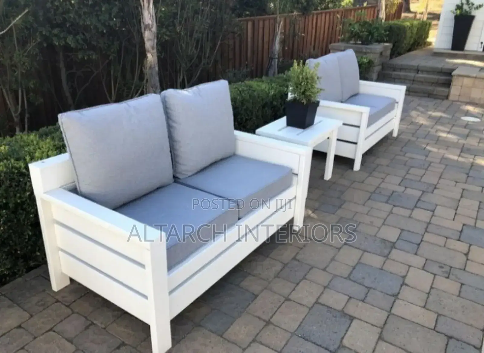 Well Furnished Wooden Chairs in White With a Table