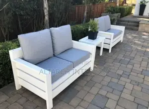 Well Furnished Wooden Chairs in White With a Table