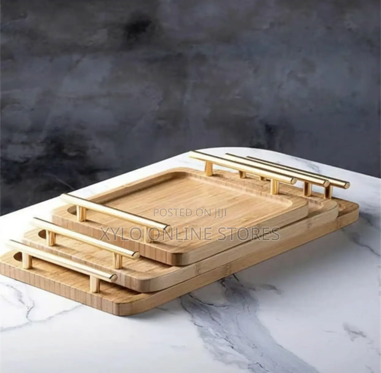 A Set of 3 Bamboo Trays With a Gold Handle