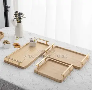 A Set of 3 Bamboo Trays With a Gold Handle