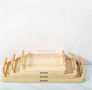 A Set of 3 Bamboo Trays With a Gold Handle