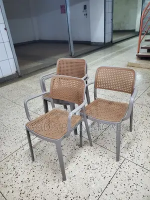 Stackable Gray Plastic Chairs Textured