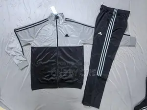 Adidas Tracksuit, a Jacket and Matching Pants.