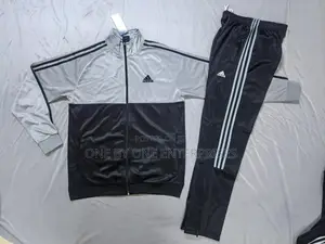Adidas Tracksuit, a Jacket and Matching Pants.