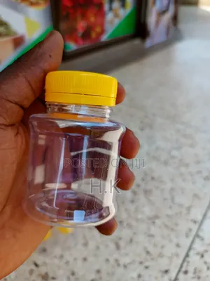 120ml Disposable Clear Plastic Bottle With a Yellow Screw-on Lid 1