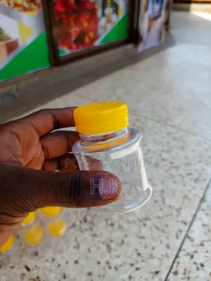 120ml Disposable Clear Plastic Bottle With a Yellow Screw-on Lid 1