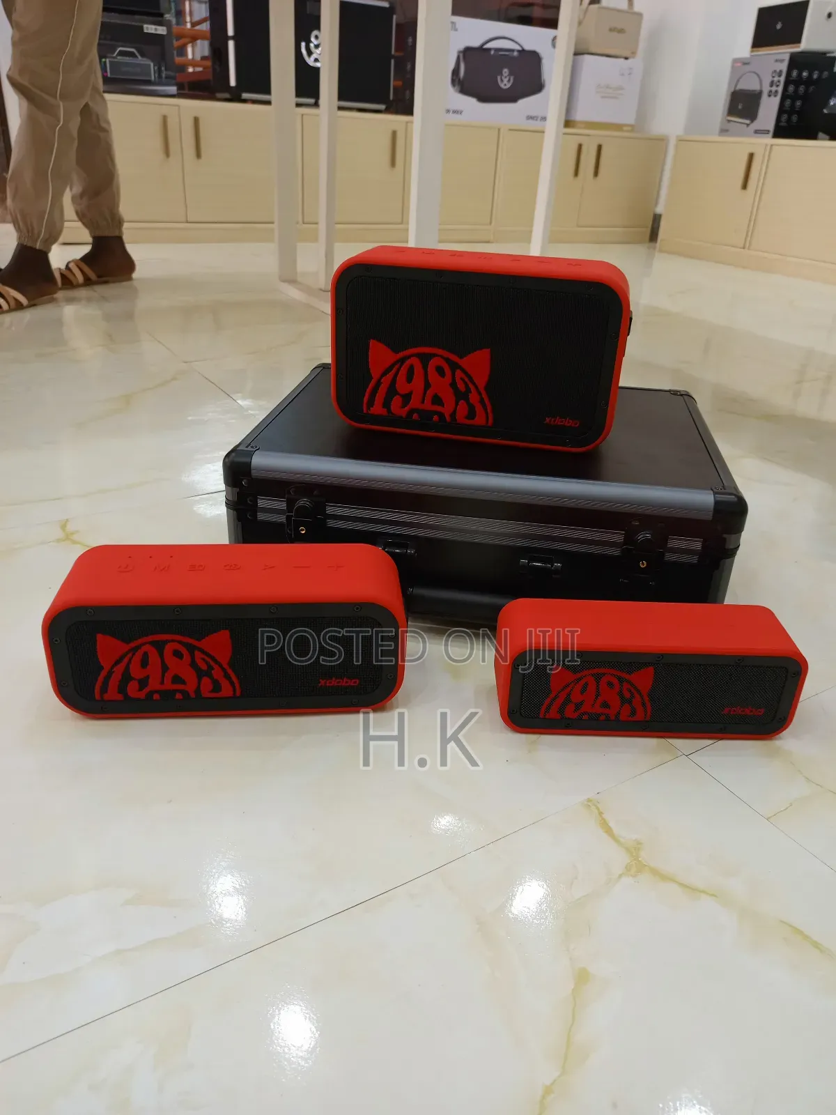 Xdobo 1983 Series Portable Bluetooth Speakers and a Carrying Case.