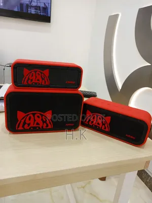 Xdobo 1983 Series Portable Bluetooth Speakers and a Carrying Case.