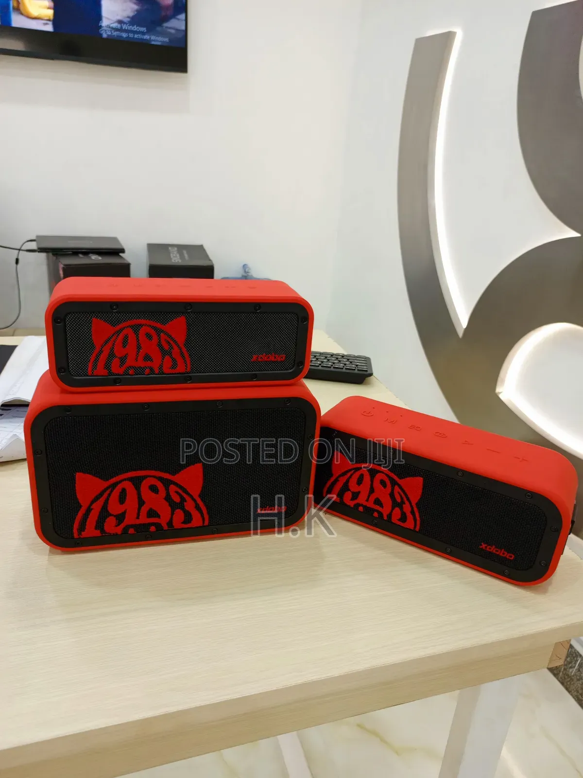 Xdobo 1983 Series Portable Bluetooth Speakers and a Carrying Case.