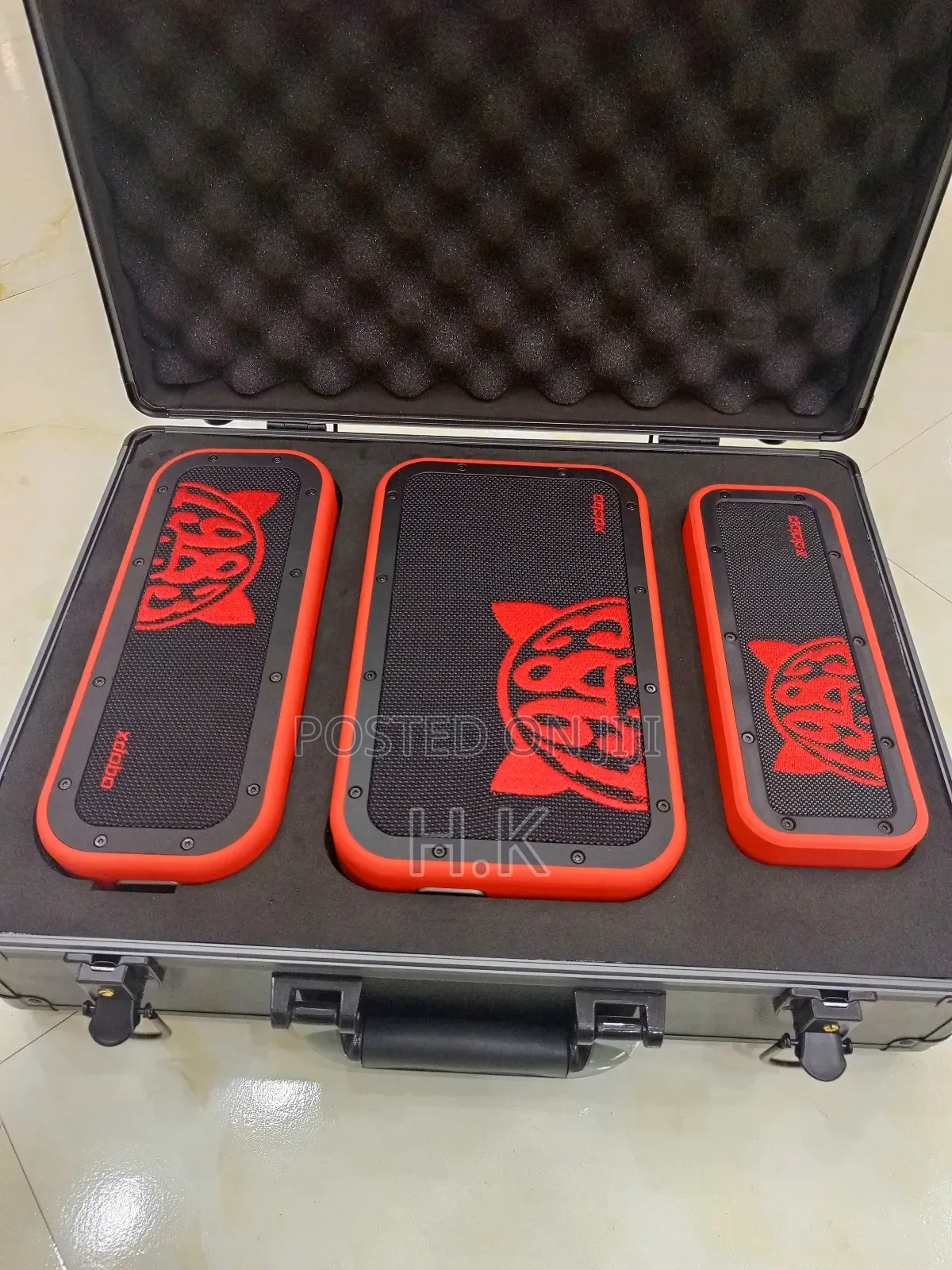 Xdobo 1983 Series Portable Bluetooth Speakers and a Carrying Case.