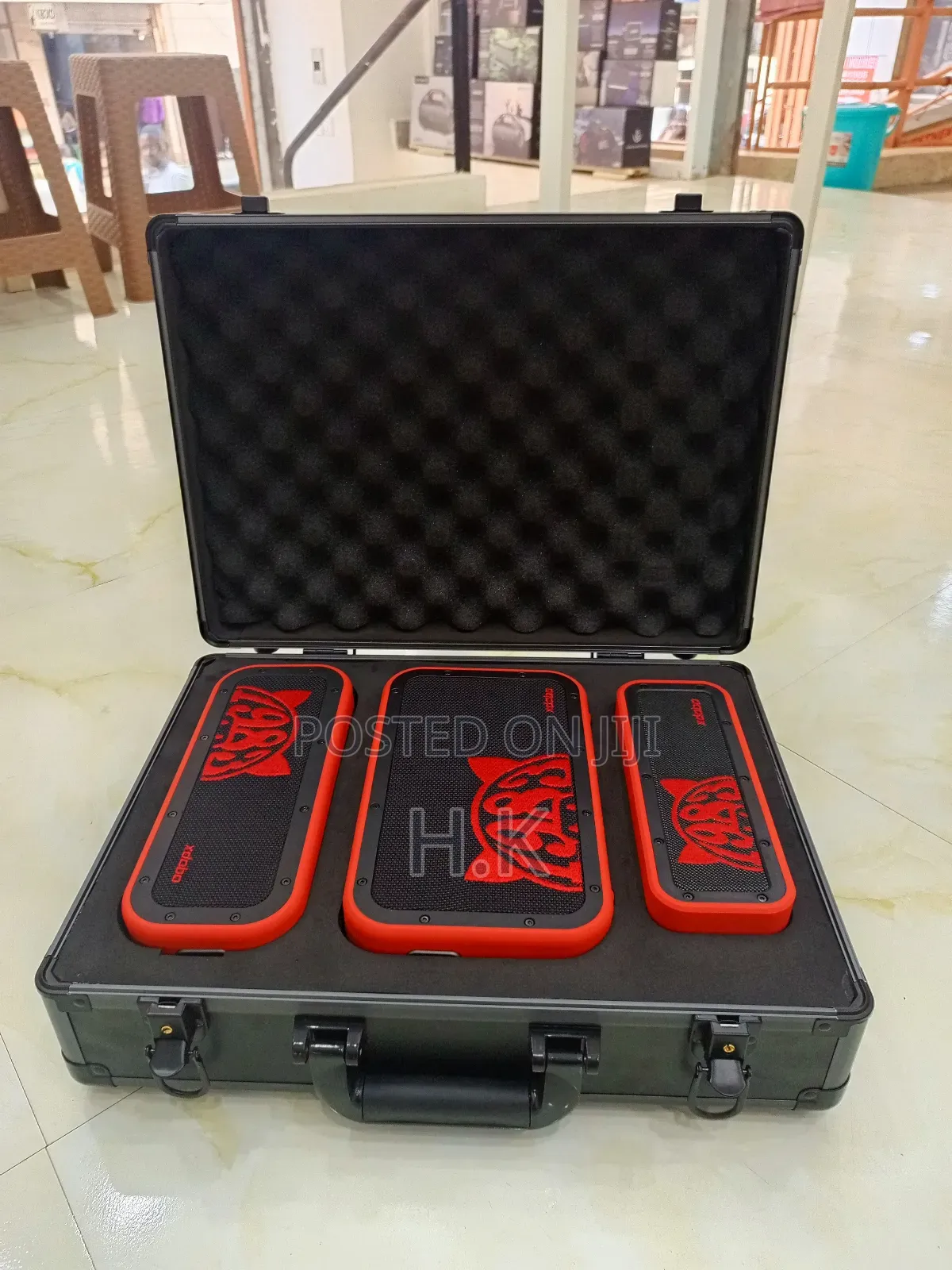Xdobo 1983 Series Portable Bluetooth Speakers and a Carrying Case.