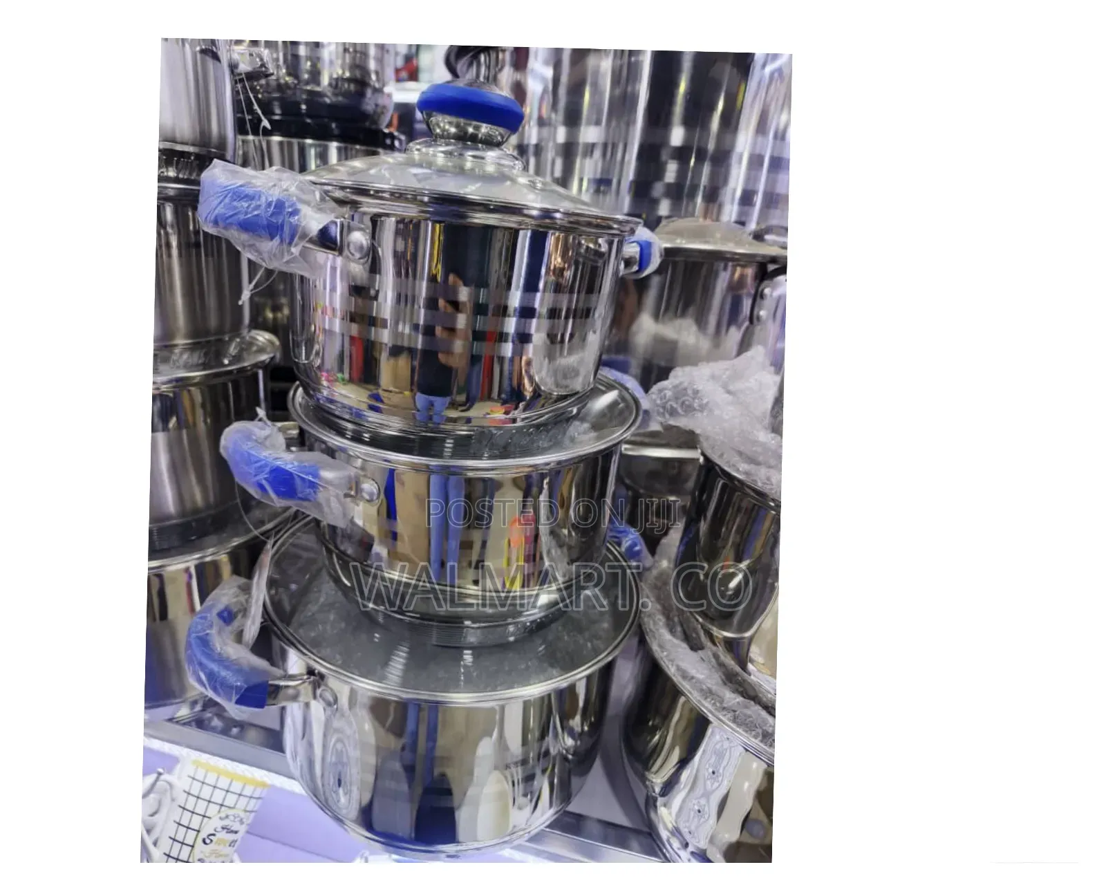 A Set of Stainless Steel Dishes With Lids