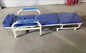 Patient Bed With a Bedside Locker and a Care Taker’S Chair