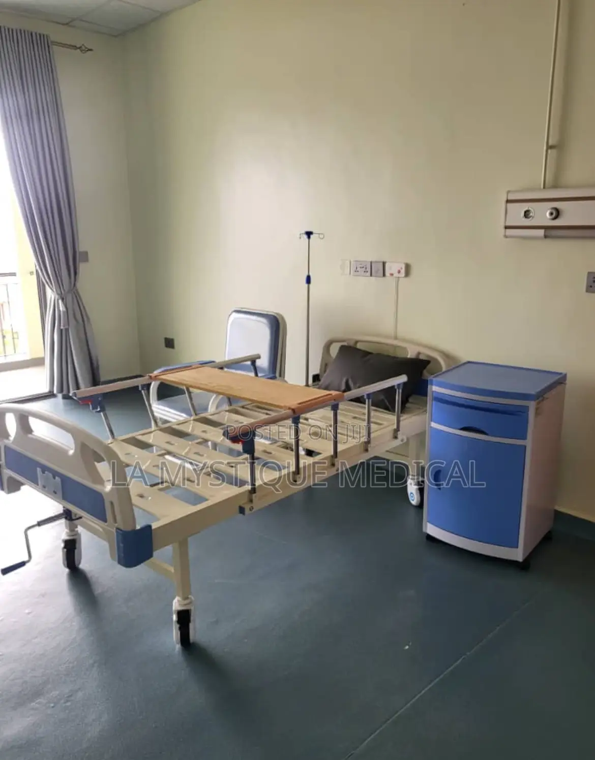 Patient Bed With a Bedside Locker and a Care Taker’S Chair