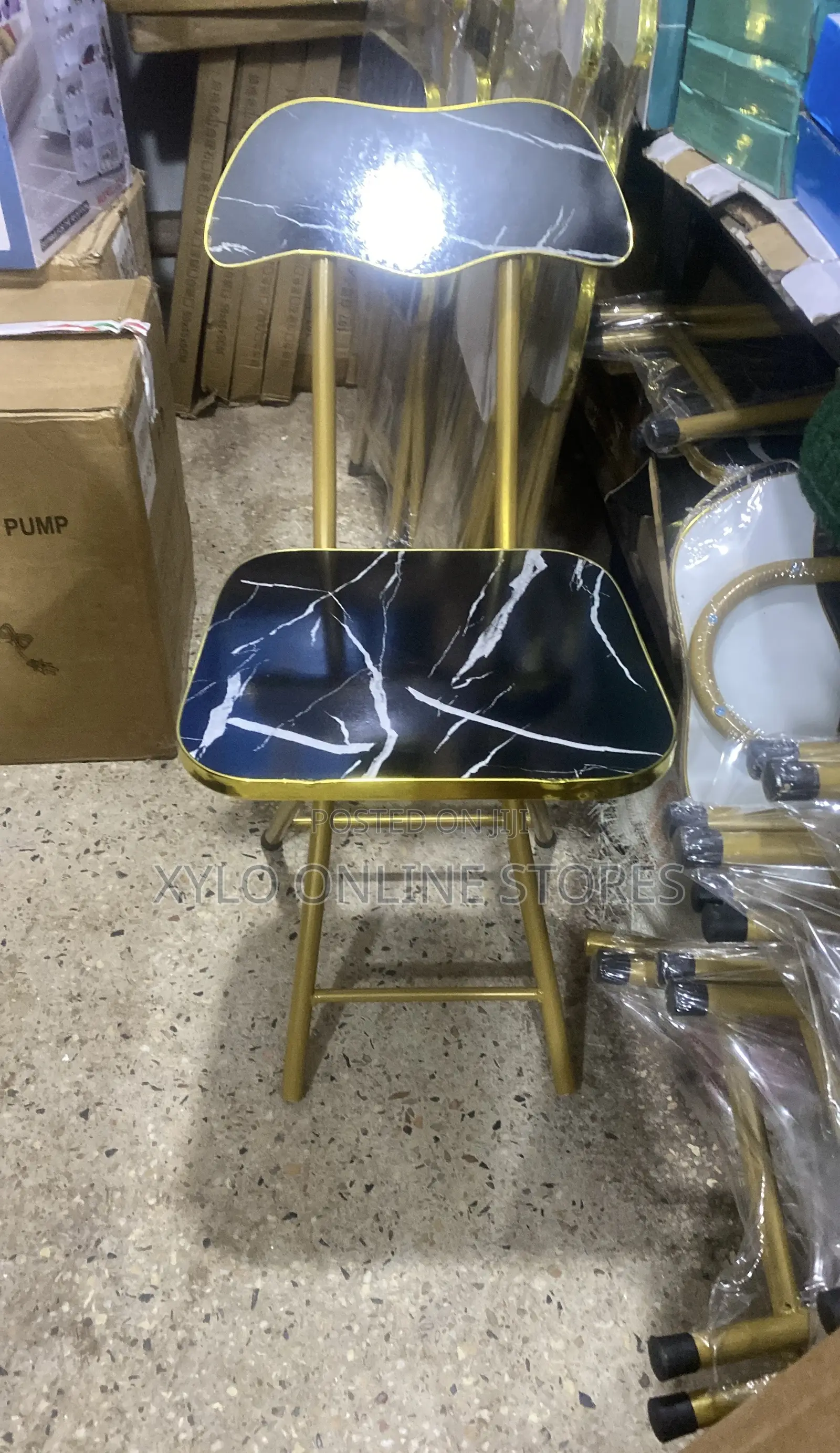 Portable Foldable Chair With a Gold Color Metal