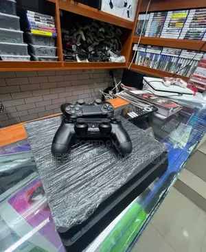 Chipped Ps4 Slim Console Great Condition. Comes With 12 Games 2 Pads