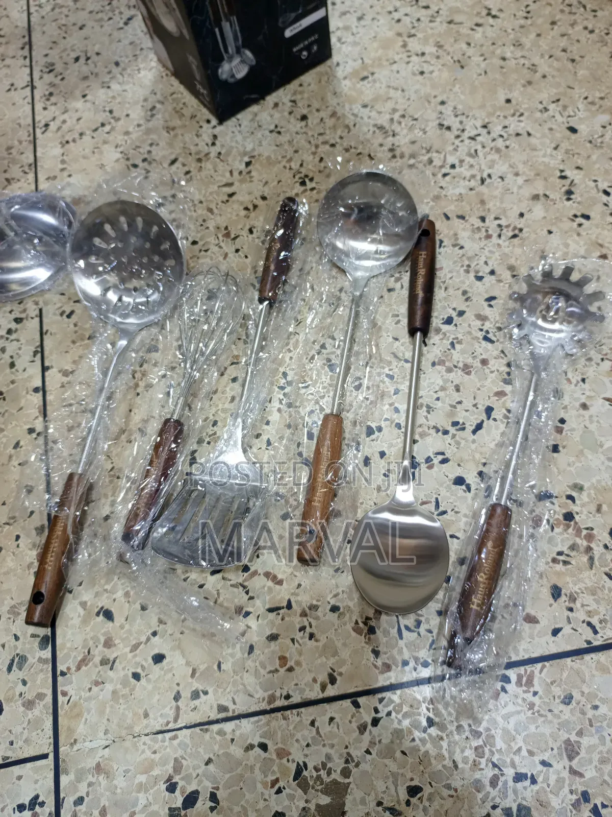 Durable Stainless Steel Kitchen Utensil Set With a Stand.