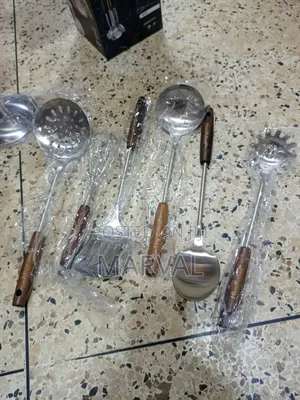 Durable Stainless Steel Kitchen Utensil Set With a Stand.