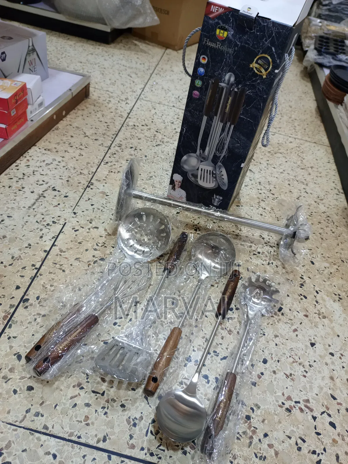 Durable Stainless Steel Kitchen Utensil Set With a Stand.