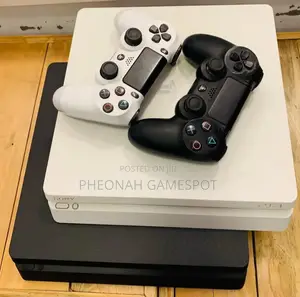Playstation Slim Ps4 Slim, Dual Controllers a Vault of 10 Games Here
