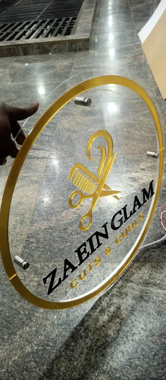 Gold and Black Floating Logo