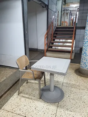 Considered Armed Plastic Chair and Table