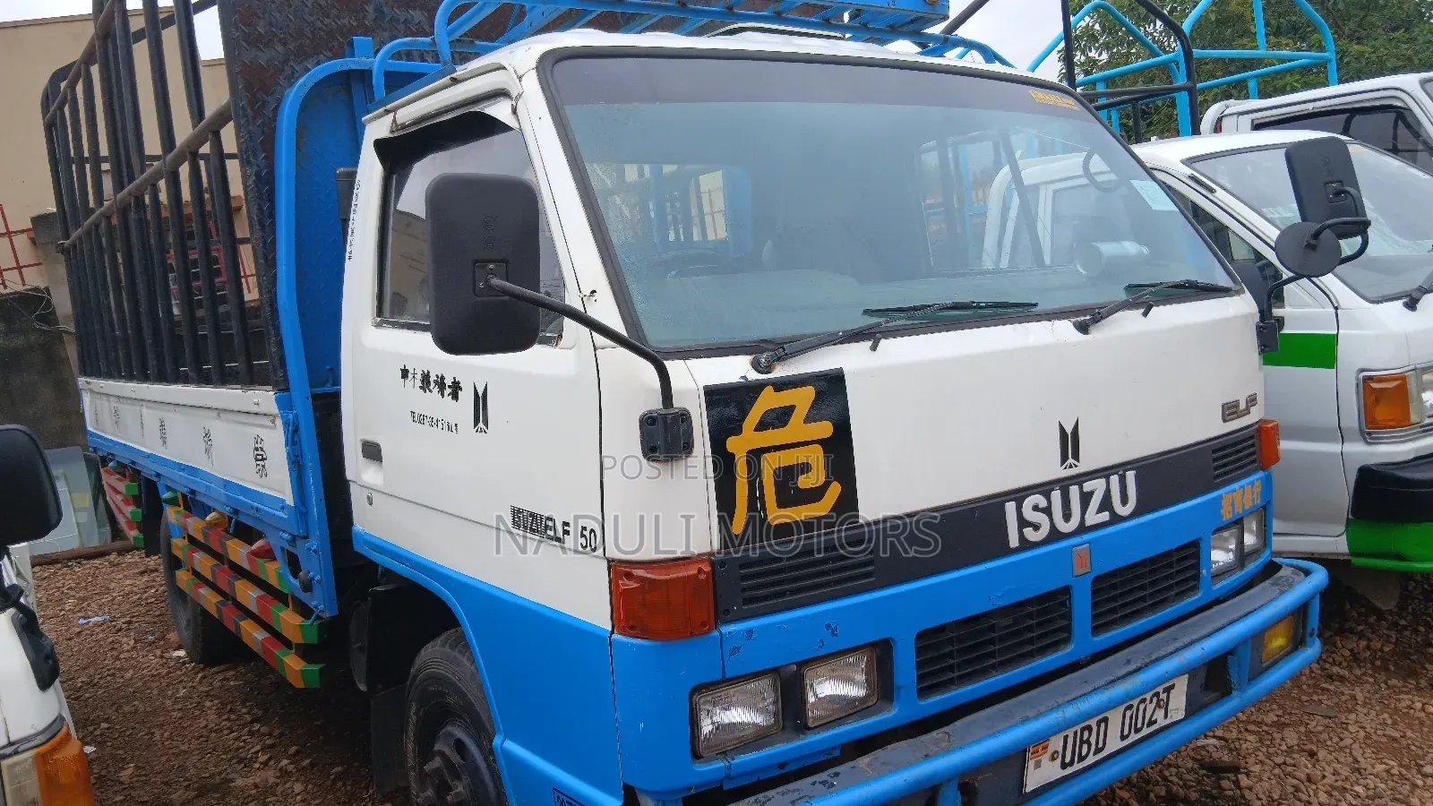 Isuzu Elf White and Blue Truck
