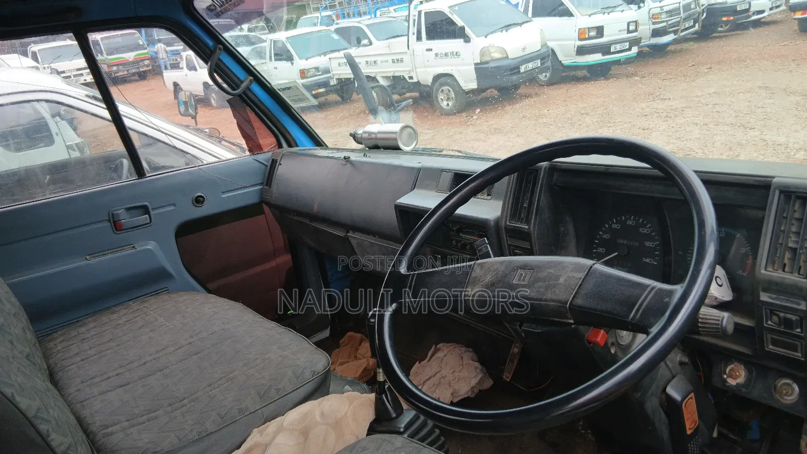 Isuzu Elf White and Blue Truck